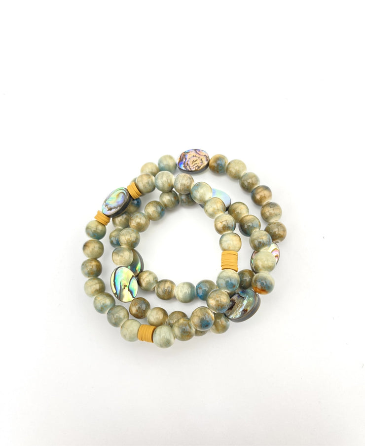 Ceramic and abalone bracelet stack
